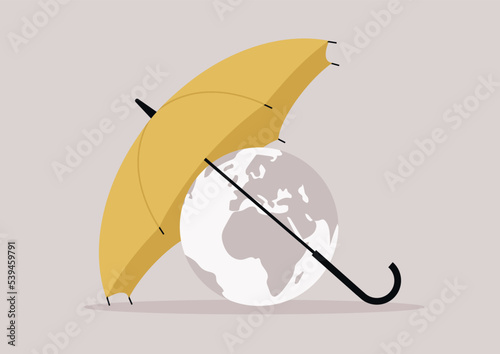 Planet Earth protected with a yellow umbrella, climate change concept