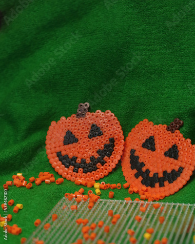Craft for kids from thermo plastic. Halloween thermo mosaic pumpkins
