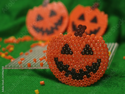 Craft for kids from thermo plastic. Halloween thermo mosaic pumpkins