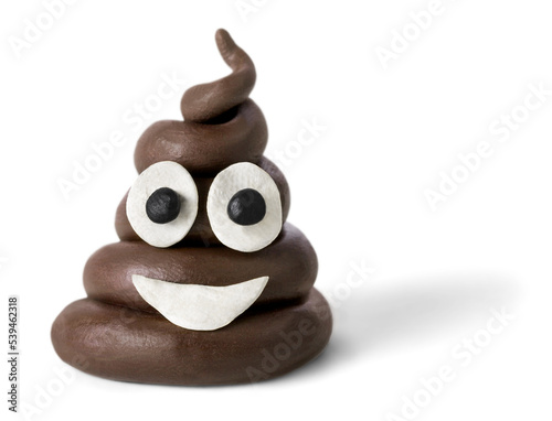 Art emoticon brown poop with eyes and mouth photo