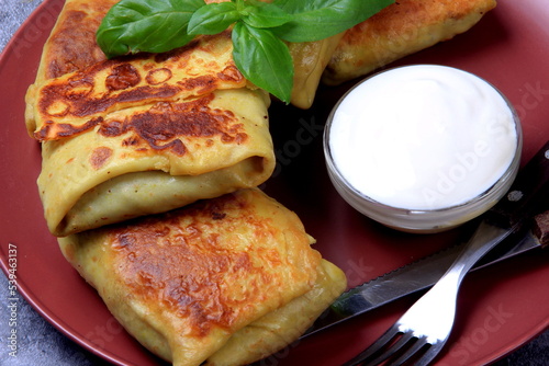 Traditional russian pancakes or blini with curd. Pancakes filled with minced heart or meat