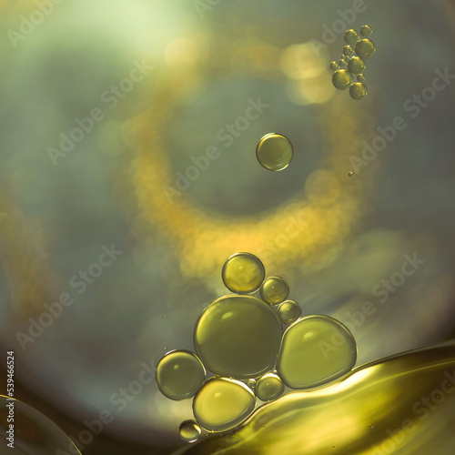 Yellow fat, like obesity cells under a microscope, is a close-up chemical process of atoms and molecules.