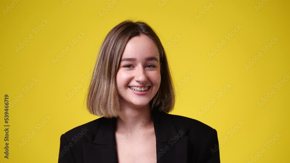 4k video of excited woman over yellow background. 4k video of excited woman over yellow background.