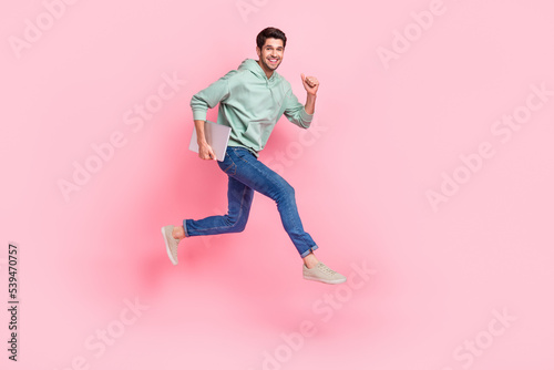 Full length photo of overjoyed man wear trendy clothes move empty space hurry work business meeting isolated on pink color background