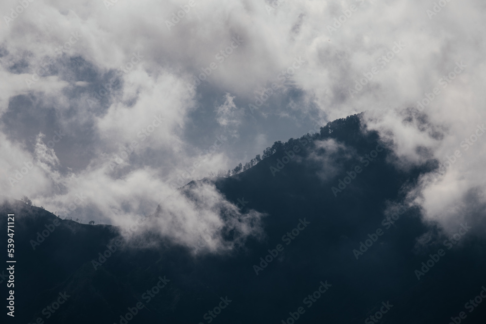 Close-up view of mountain peaks and clouds. Close-up view of mountain peaks and clouds.