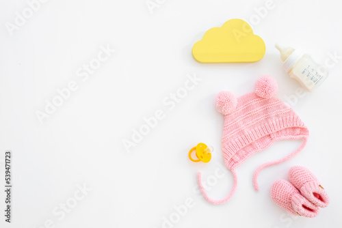 Baby girl pink hat with booties and accessories, top view