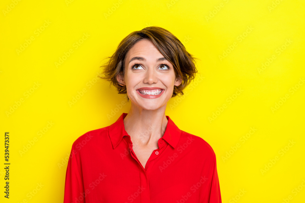 Photo of good mood adorable positive nice girl with bob hairdo dressed red shirt look empty space isolated on yellow color background Photo of good mood adorable positive nice girl with bob hairdo dressed red shirt look empty space isolated on yellow color background