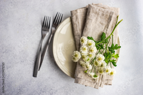 Mini aster flowers in the table set decor photo