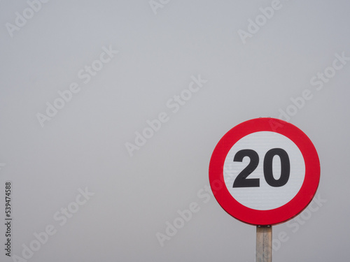 Traffic sign limiting speed to 20 km/h with copy space
