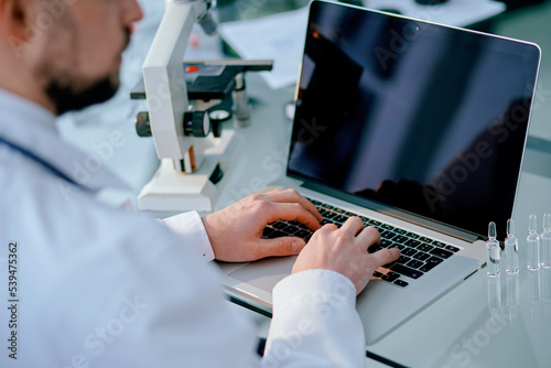 background image of a scientist working in a medical laboratory.