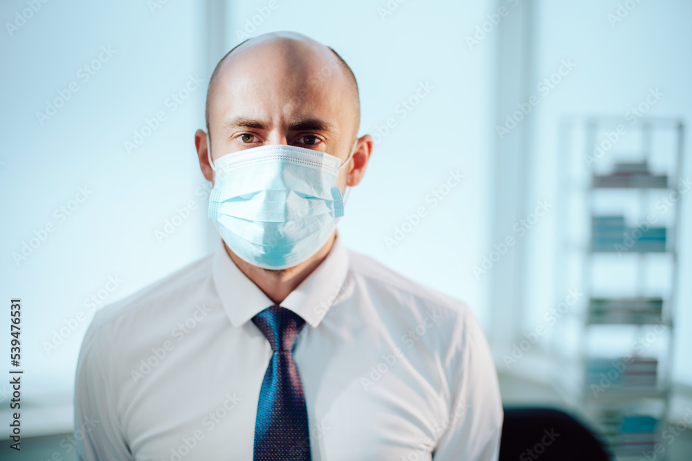 scientist in a protective mask on the background of a medical laboratory. scientist in a protective mask on the background of a medical laboratory.