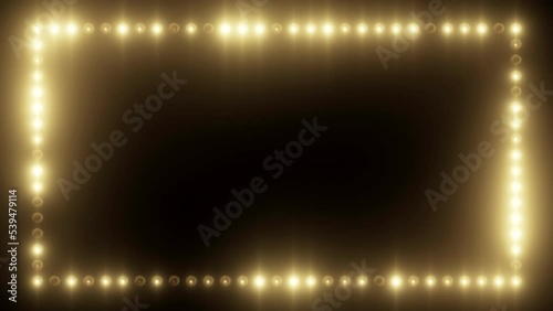 Flickering glowing frame animation of light bulbs on a black background. Bright seamless loop motion graphics of light film border. Stage light wall with blinking effect