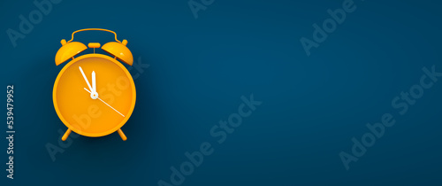 Orange vintage alarm clock on color background - hurry up, last chance concept with copy space photo