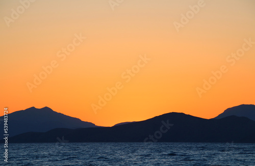 Orange sky during sunset over mountains at the sea  Tigaki  Kos Island  Greece 