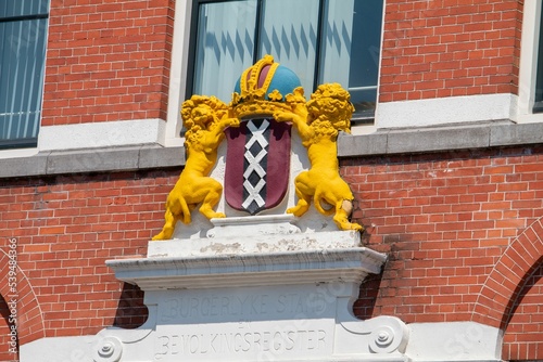 Photography Coat of arms of Amsterdam on the facade of a brick building