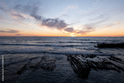 Sunsets in Cilento  Italy. Fiery horizons at sunset. wave motion.