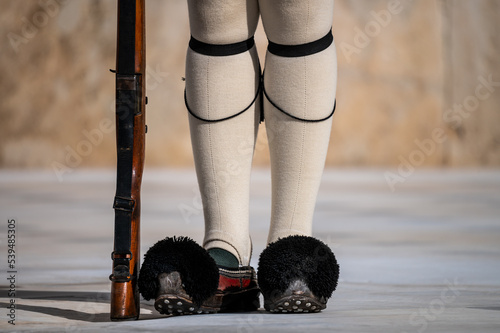 Detail of the shoes and tights of a soldier of the Royal Guard during the change of the guards in front of the Parliament of Greece photo