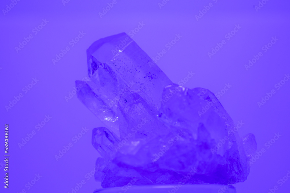 Fototapeta premium Quartz with mineral crystals against a black background