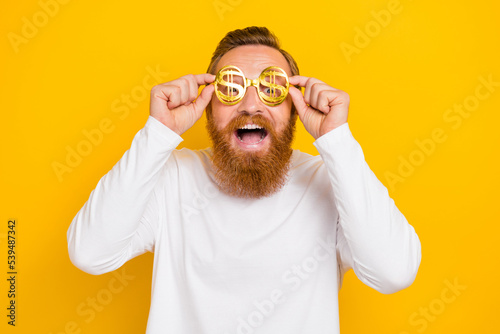 Fotografia, Obraz Photo of hooray beard orange hair man wear eyewear white shirt isolated on yello