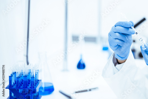 background image of a laboratory assistant in a medical laboratory