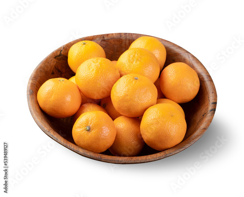Mini tangerines in a bowl isolated over white background