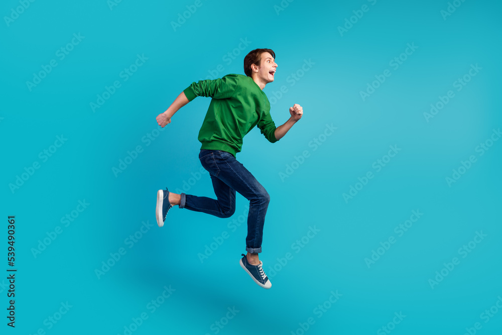 Full body photo of running jumping crazy man enjoying discounts isolated vivid color background