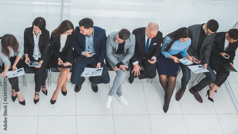 top view. young employees discussing financial data.
