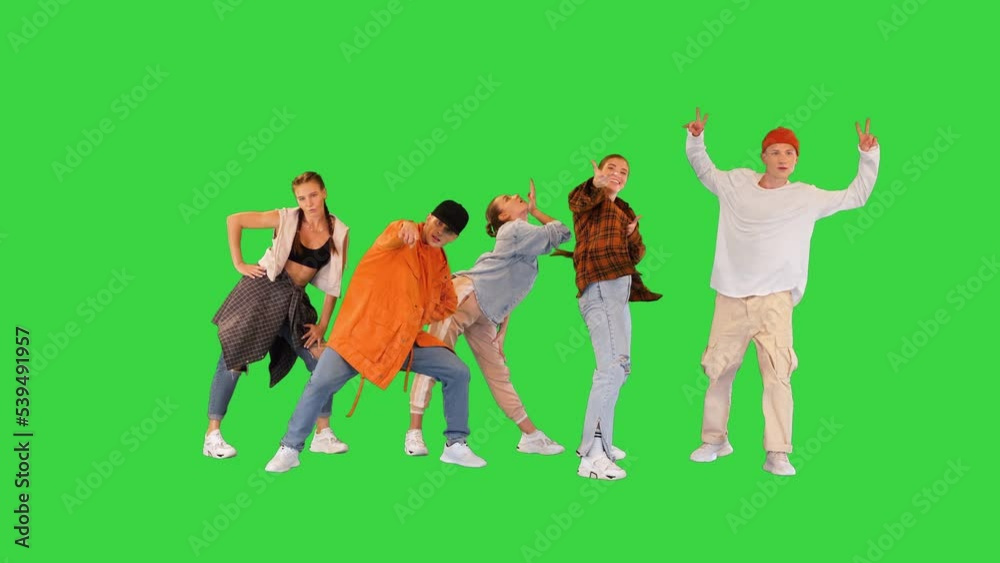 Modern dancers changing poses to the rhythm on a Green Screen, Chroma Key. Modern dancers changing poses to the rhythm on a Green Screen, Chroma Key.