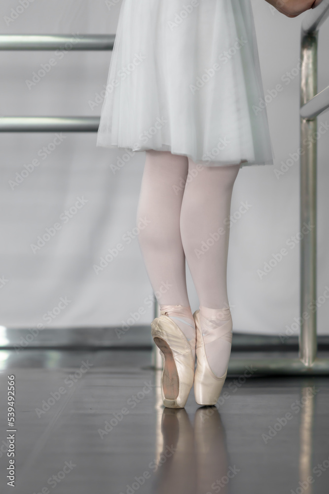 beautiful legs of a girl ballerina wearing pointe shoes background from above with copy space practicing ballet slim elegant feet of ballet dancers beautiful legs of a girl ballerina wearing pointe shoes background from above with copy space practicing ballet slim elegant feet of ballet dancers