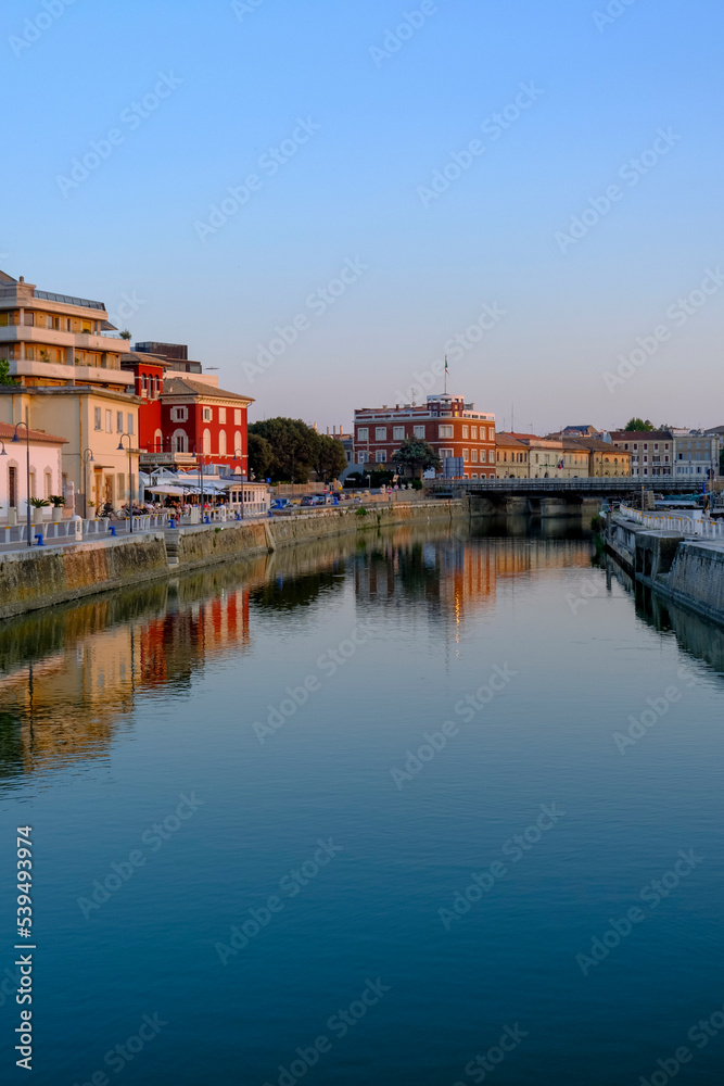 view of the canal of Senigallia, Italy on the sunset over the architecture. Urban view. City postcard