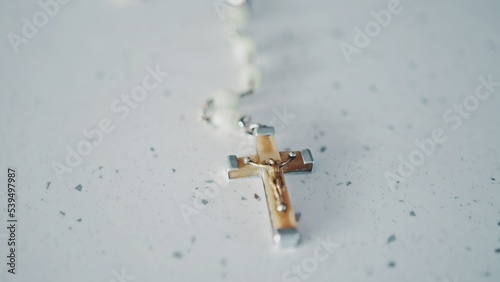 Prayer Holy Rosary With White Pearl Beads and Cross with Jesus Christ Figure photo