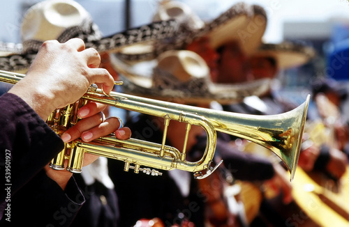 Mexician musicians performing outdoors.