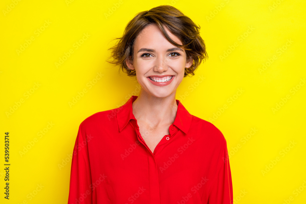 Photo of nice cute satisfied pleasant woman with bob hairstyle dressed red shirt toothy smiling isolated on yellow color background Photo of nice cute satisfied pleasant woman with bob hairstyle dressed red shirt toothy smiling isolated on yellow color background