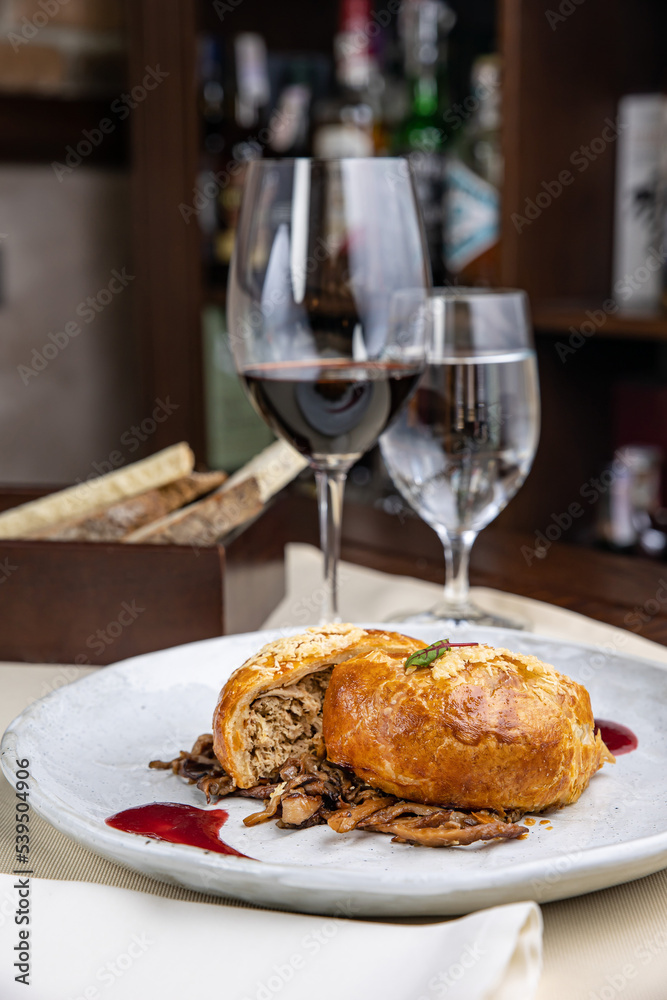 delicious baked meat pie on a wooden table
delicious baked meat pie on a wooden table