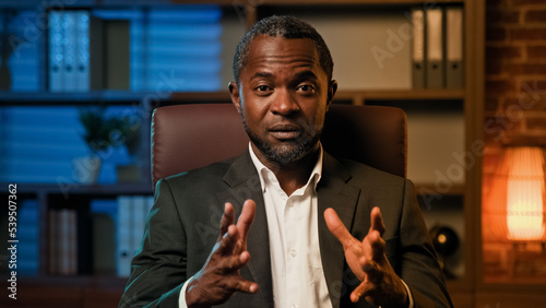 Canvas Print Serious professional businessman looking at camera negotiating on video call sma