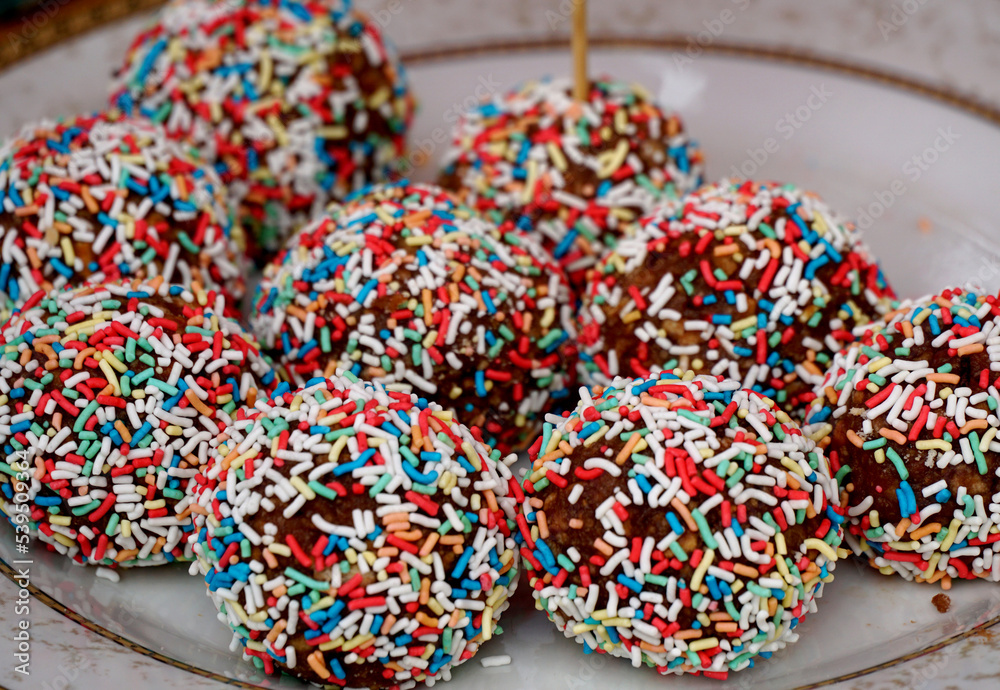 Homemade chocolate balls  with sprinkles .