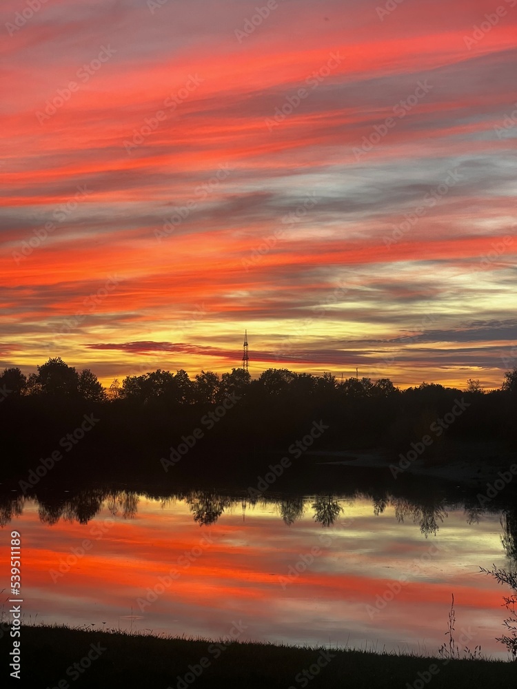 Obraz premium sunset over the river