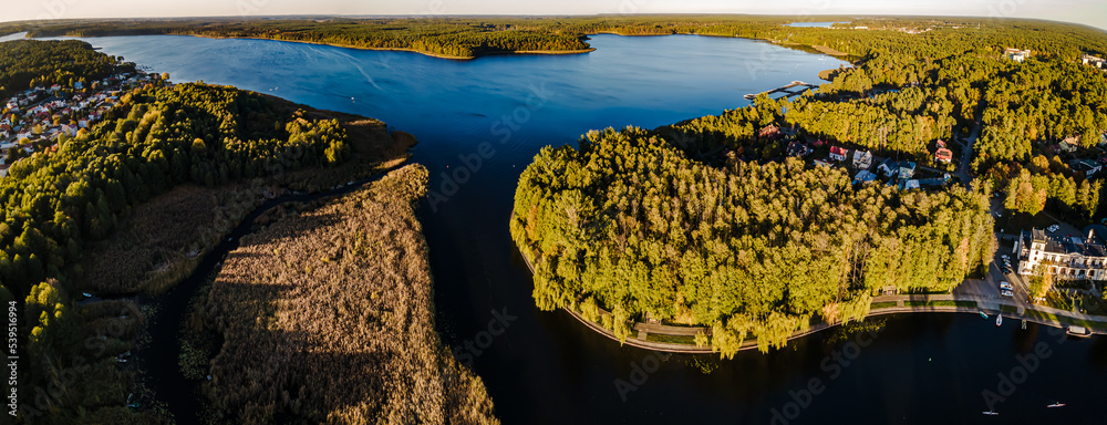 Top view of the Augustow Canal and Lake Necko on an autumn day at sunset.