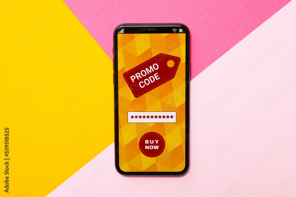 Smartphone with activated promo code on colorful background, top view