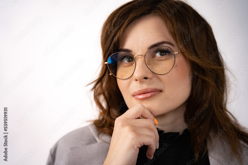 Portrait of a young, attractive businesswoman with glasses on a white background Portrait of a young, attractive businesswoman with glasses on a white background