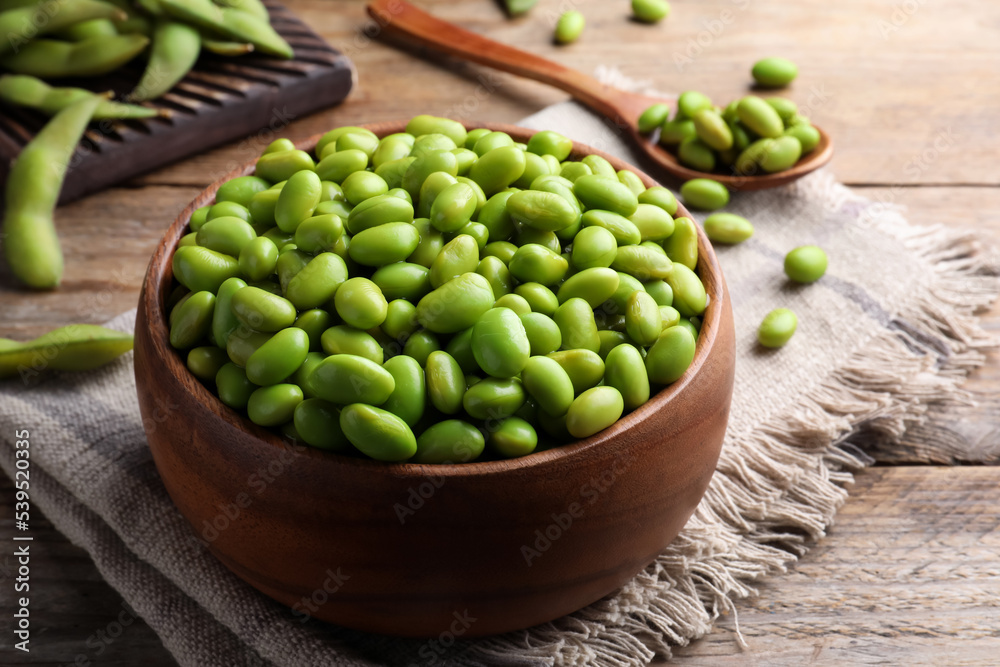 Bowl of delicious edamame beans on wooden table Bowl of delicious edamame beans on wooden table
