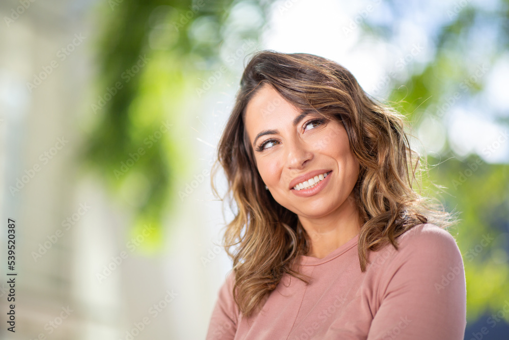Close up portrait young woman smiling with a glance Close up portrait young woman smiling with a glance