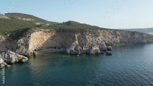 Aerial shot of cliffs and rocks on the coast in Sesimbra, Portugal photo