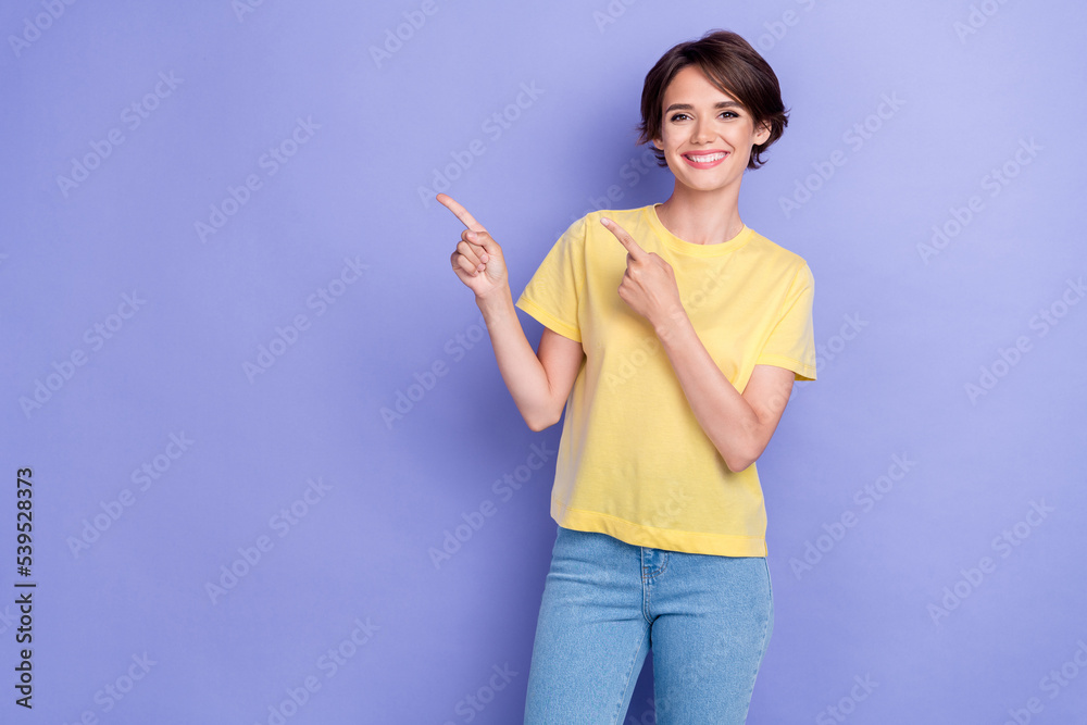 Portrait photo of young pretty nice cute woman wear stylish summer outfit fingers pointing empty space smile isolated on purple color background Portrait photo of young pretty nice cute woman wear stylish summer outfit fingers pointing empty space smile isolated on purple color background