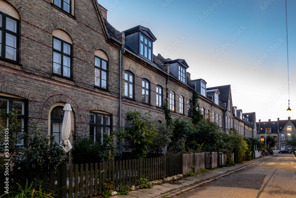 Copenhagen, Denmark,  Row houses and a quiet street in the Humleby district of Vesterbro.