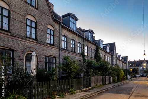 Copenhagen, Denmark, Row houses and a quiet street in the Humleby district of Vesterbro.