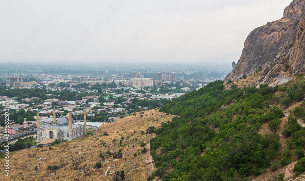 Panorama of Osh town from Sulaiman-Too mountain. The rock Suleiman-too. Osh, Kyrgyzstan