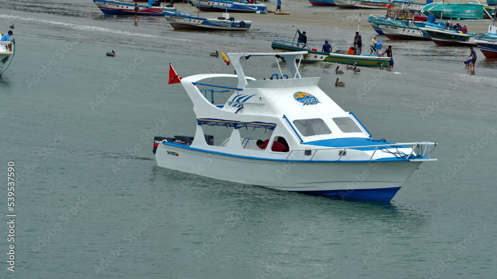 Obraz premium Tour boat in the harbor in Puerto Lopez, Ecuador