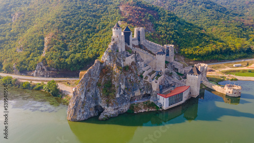 Aerial photography of Golubac medieval fortress located on the Danube river on Serbian bank. Photography was shot from a drone at higher altitude with camera level for a panoramic shot.