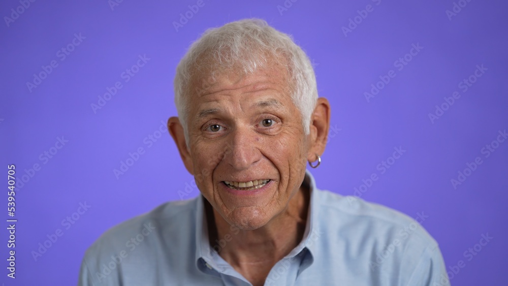 Closeup portrait of a smiling handsome middle aged man 70s. Mature caucasian man showing real emotions being happy, confident and likable. Closeup portrait of a smiling handsome middle aged man 70s. Mature caucasian man showing real emotions being happy, confident and likable.